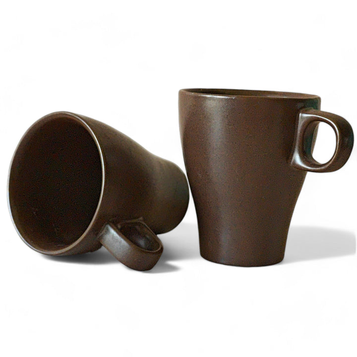 Display image of brown ceramic coffee mug with a glossy finish and ergonomic handle.