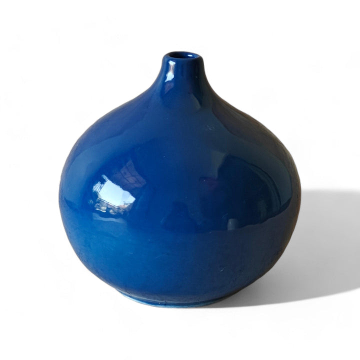 Display image of Glossy blue ceramic vase with a round bulbous shape and narrow neck.