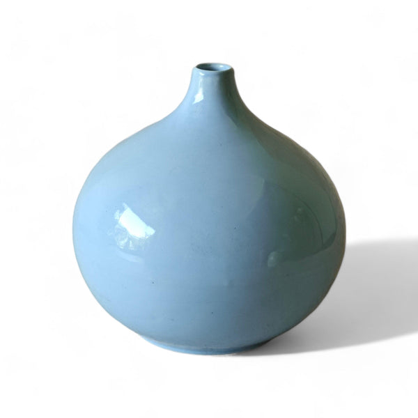 Display image of light blue ceramic vase with a round bulbous shape and narrow neck.