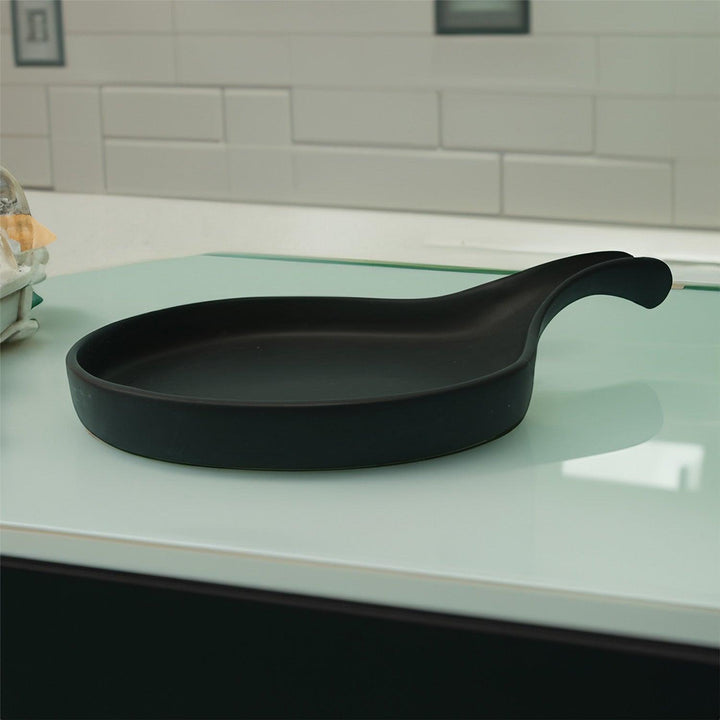 Display image of Black ceramic Streamline Platter featuring minimalist design for modern table settings; perfect for serving appetizers, desserts, or main courses. Crafted from high-quality, durable ceramic, this elegant platter is microwave and dishwasher safe, non-toxic, and includes a non-slip base for added safety and convenience. Ideal for both casual meals and special occasions.