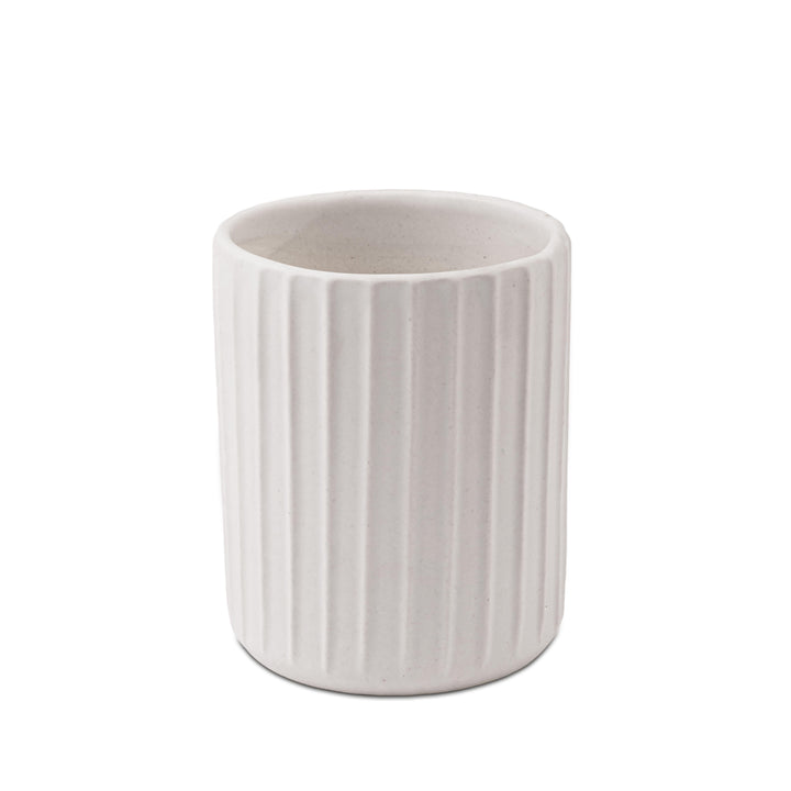 Display image of  a white ribbed ceramic planter placed near a window with natural light.