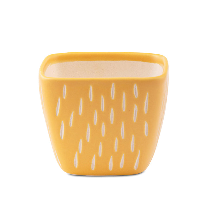 Display image of Splash of Style: The Raindrop Planter - Handmade yellow ceramic raindrop planter featuring a playful design, high-quality durable construction, and non-slip base, perfect for showcasing a variety of plants while adding a vibrant touch of color and whimsy to your home décor.