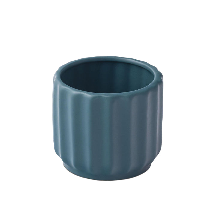 Display image of deep sea green ceramic planter with a ribbed texture and glossy finish.