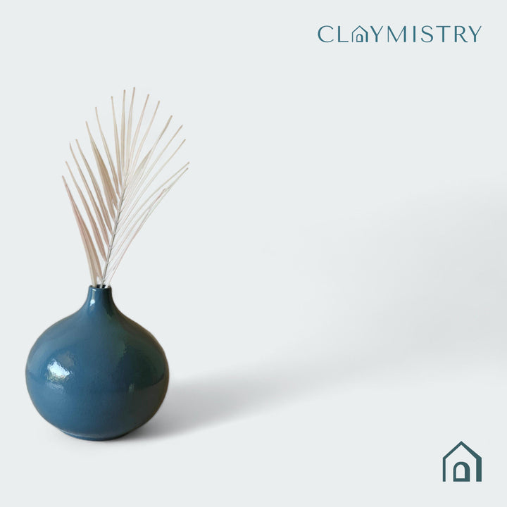 Display image of grey ceramic vase with a round bulbous shape and narrow neck.