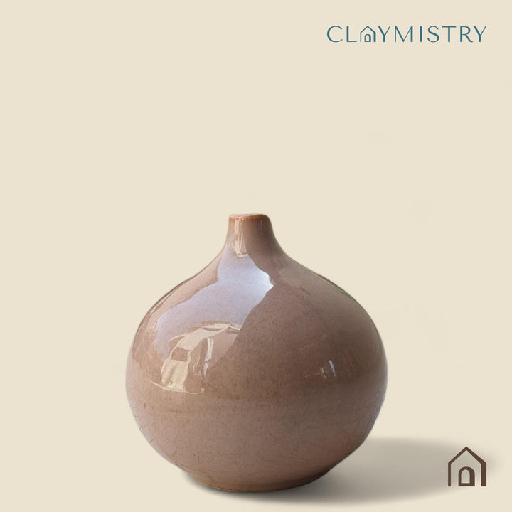 Display image of coffe color ceramic vase with a round bulbous shape and narrow neck.