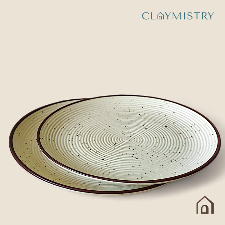 Display image of Whispering Sands: Ivory & Caramel Dusk Dinner Plate – Elegant ceramic dinner plate in ivory and caramel hues, featuring a non-slip base, microwave and dishwasher safe, crafted from lead-free and cadmium-free materials for safe, stylish dining