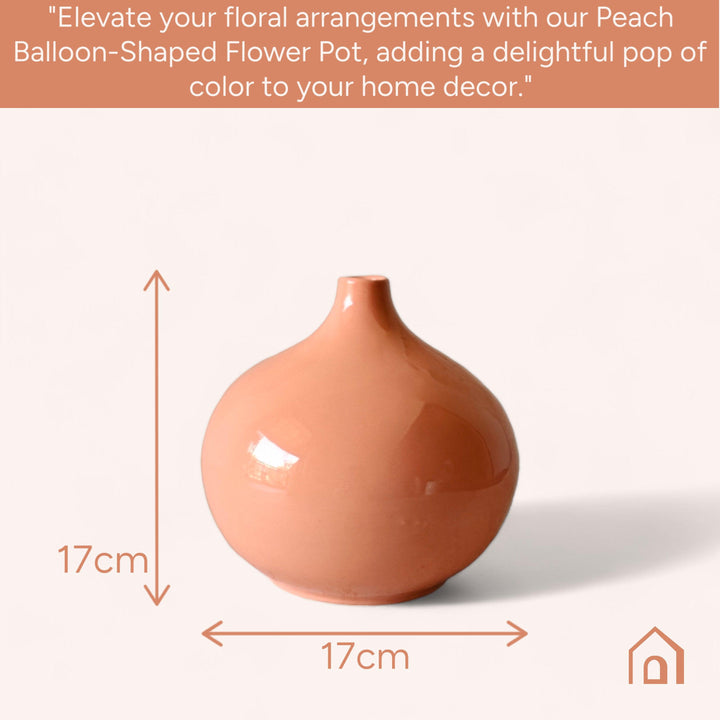 Display image of Glossy peach ceramic vase with a round bulbous shape and narrow neck.