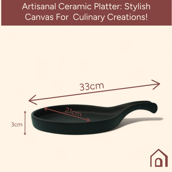 Display image of Black ceramic Streamline Platter featuring minimalist design for modern table settings; perfect for serving appetizers, desserts, or main courses. Crafted from high-quality, durable ceramic, this elegant platter is microwave and dishwasher safe, non-toxic, and includes a non-slip base for added safety and convenience. Ideal for both casual meals and special occasions.