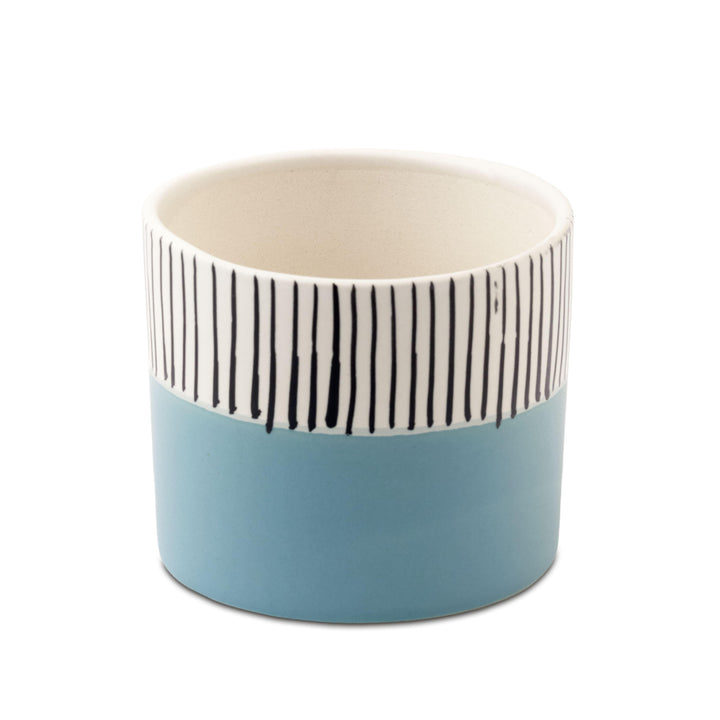 Display image of blue and white ceramic planter with vertical stripe detailing on the upper half and a smooth matte finish.