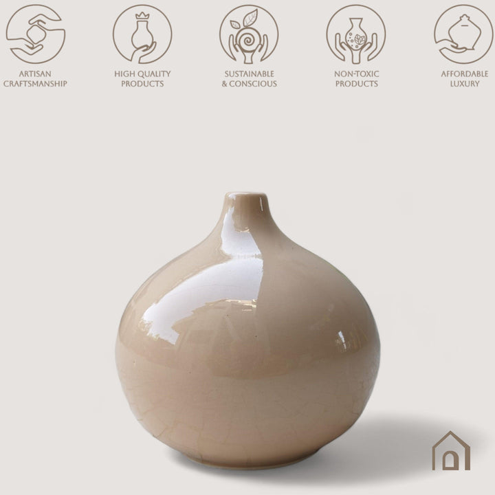 Display image of coffe color ceramic vase with a round bulbous shape and narrow neck.