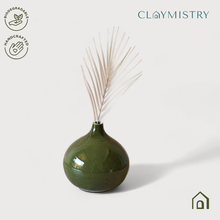 Display image of olive green ceramic vase with a round bulbous shape and narrow neck.