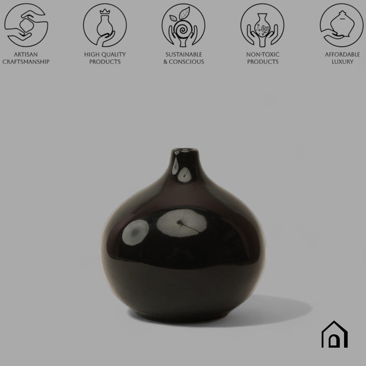 Display image of black ceramic vase with a round bulbous shape and narrow neck.