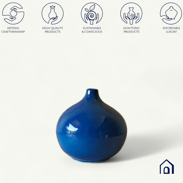 Display image of Glossy blue ceramic vase with a round bulbous shape and narrow neck.