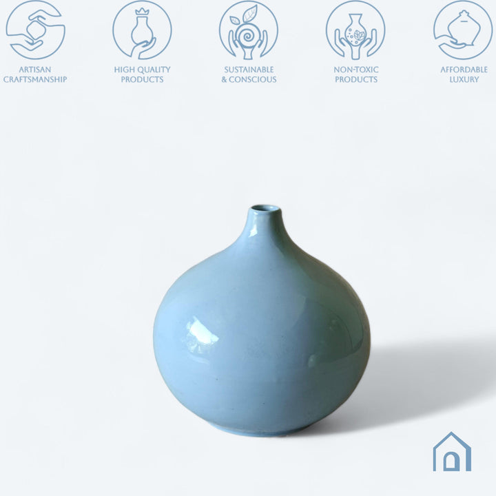 Display image of light blue ceramic vase with a round bulbous shape and narrow neck.