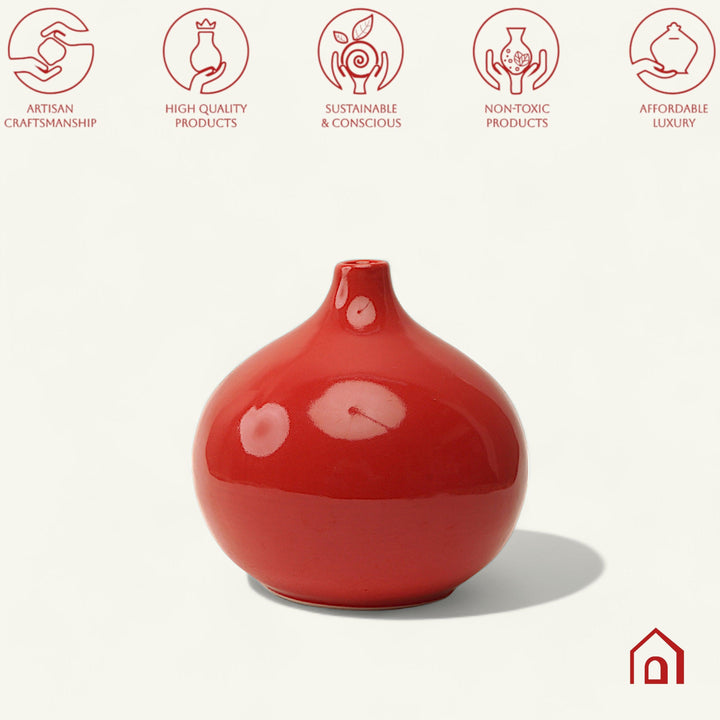 Display image of red ceramic vase with a round bulbous shape and narrow neck.