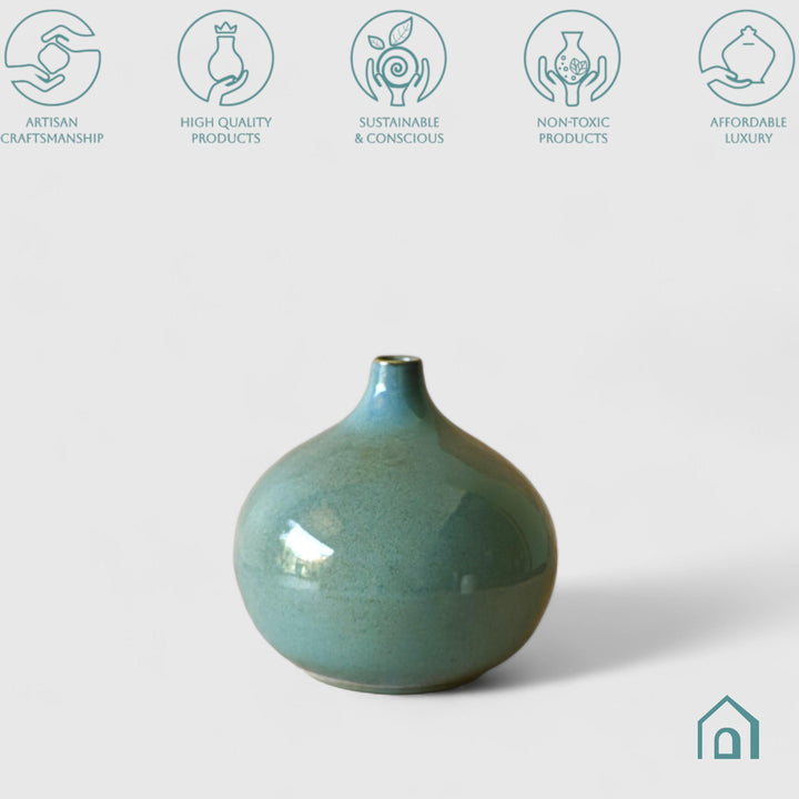 Display image of sea green ceramic vase with a round bulbous shape and narrow neck.