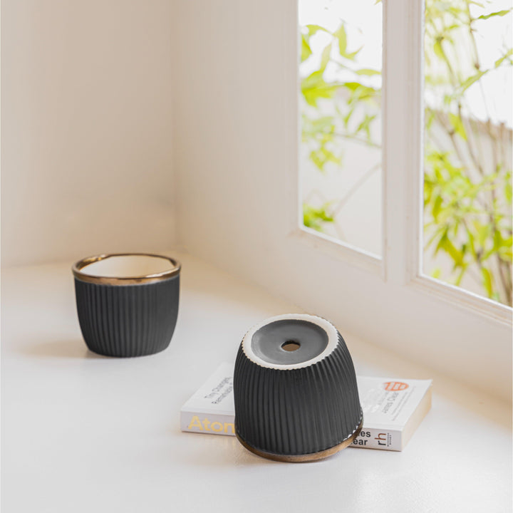 Display image of Handcrafted Top Trimmed ceramic planter with a ribbed texture in a black tone and a black rim, designed for indoor use.