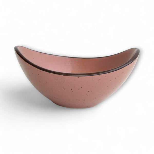 Display image of Handcrafted ceramic bowl in matte pink with speckled details and dark brown rim.