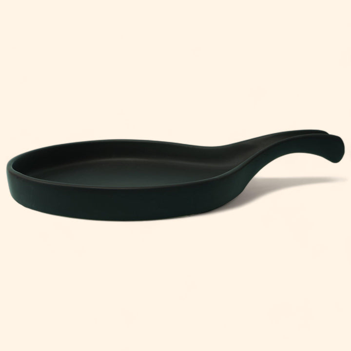 Display image of black ceramic Streamline Platter featuring minimalist design for modern table settings; perfect for serving appetizers, desserts, or main courses. Crafted from high-quality, durable ceramic, this elegant platter is microwave and dishwasher safe, non-toxic, and includes a non-slip base for added safety and convenience. Ideal for both casual meals and special occasions.