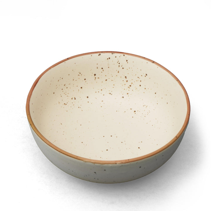 Display image of Speckled cream ceramic mug with a rustic matte finish and simple handle.