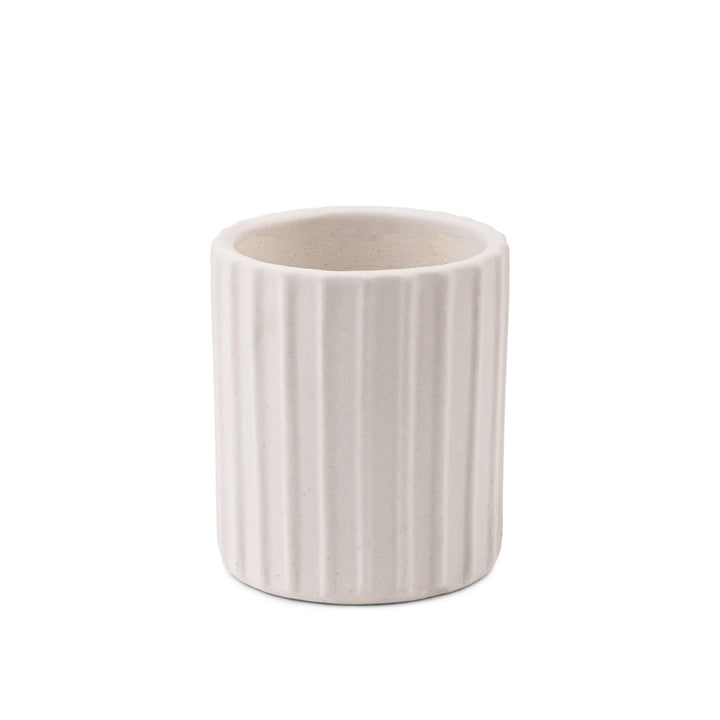 Display image of a white ribbed ceramic planter placed near a window with natural light.