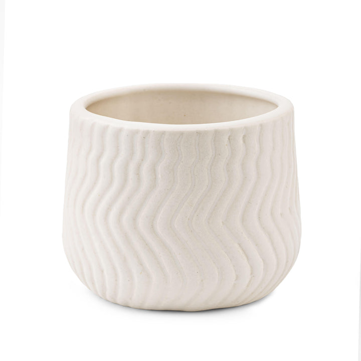 Display image of chalk white  ceramic planter with a wavy textured pattern and matte finish.