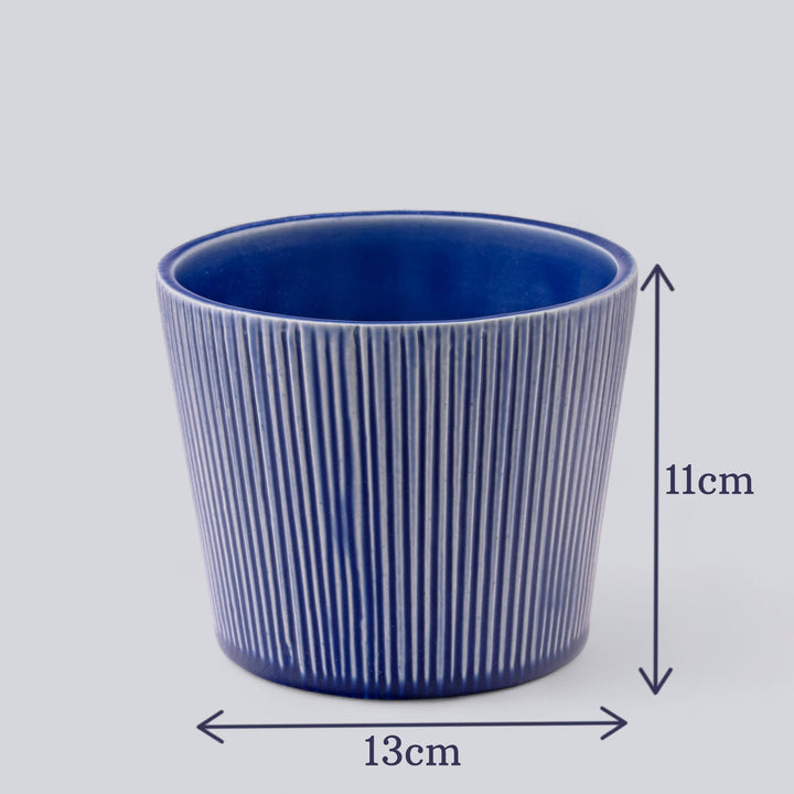 Blue ceramic planter with vertical textured lines, showing dimensions of 13cm width and 11cm height, ideal for indoor plants.