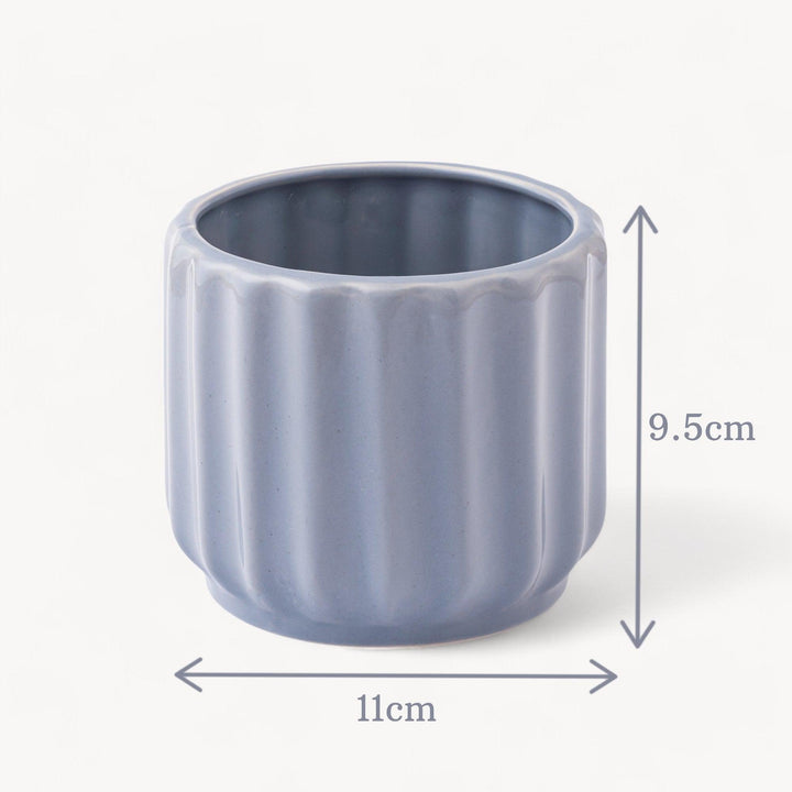 Display image of blue grey ceramic planter with a ribbed texture and glossy finish.